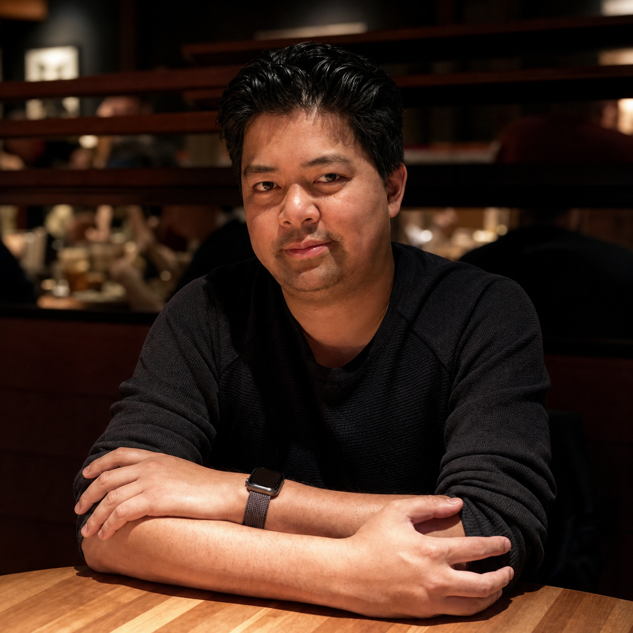 Raymond Ople seated at a restaurant